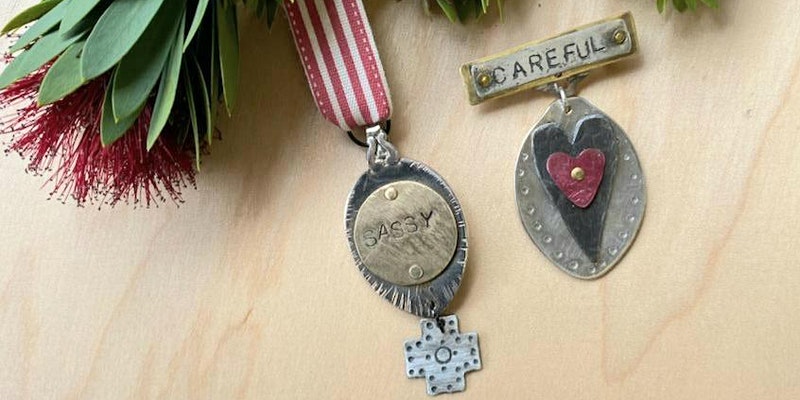 Image shows two metal medals. One says "Sassy" and one says "Careful".