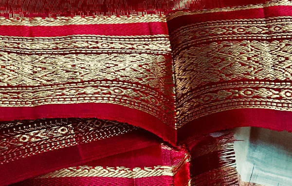 Close up of vibrant red and gold material