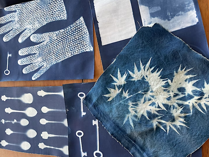 Image of cyanotype projects laid out on a table