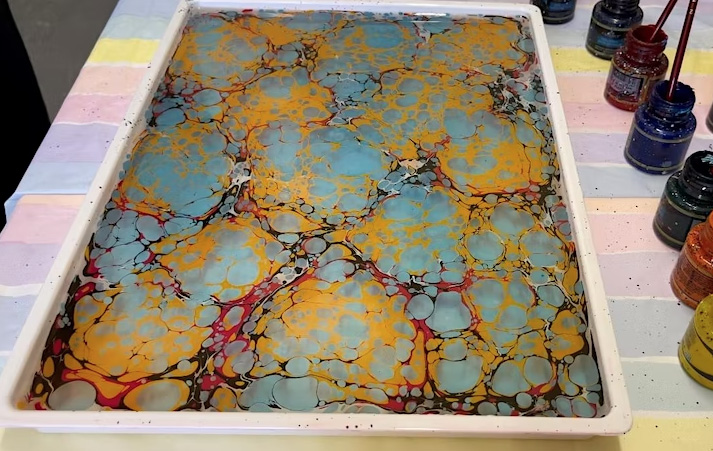 Image shows marbling solution